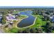 Aerial view of an expansive golf course featuring multiple water features at 8132 Summersong Ct, Spring Hill, FL 34606