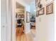 Inviting hallway with hardwood floors leading to office and living room areas at 8132 Summersong Ct, Spring Hill, FL 34606
