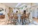 Bright kitchen with an island, bar stool seating, and custom tile flooring at 8132 Summersong Ct, Spring Hill, FL 34606