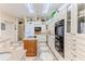 Bright kitchen features custom cabinets, central island with cooktop, and built in double ovens at 8132 Summersong Ct, Spring Hill, FL 34606