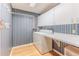 Clean laundry room with washer, dryer, counter space, and cabinets for storage at 8132 Summersong Ct, Spring Hill, FL 34606