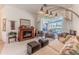 Comfortable living room features fireplace, neutral tones, and sliding door access to outdoor living area at 8132 Summersong Ct, Spring Hill, FL 34606