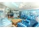 Bright living room with tile floors, ceiling fan and sliding glass doors leading to the patio at 8132 Summersong Ct, Spring Hill, FL 34606