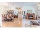 Spacious living area with a fireplace, hardwood floors, and a dining area at 8132 Summersong Ct, Spring Hill, FL 34606