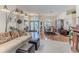 Open-concept living area showcasing the entryway, dining area, and comfortable seating at 8132 Summersong Ct, Spring Hill, FL 34606