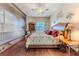 Well-lit primary bedroom showcasing a view of the pool and lanai at 8132 Summersong Ct, Spring Hill, FL 34606