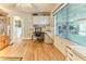 Bright office with hardwood floors, a built-in desk, and a large window at 8132 Summersong Ct, Spring Hill, FL 34606
