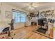 Spacious office featuring hardwood floors, dual desks, and a bright window at 8132 Summersong Ct, Spring Hill, FL 34606