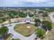 Overhead shot of community center, showcasing well-kept landscaping and amenities for residents and their guests at 8228 Coral Creek Loop, Hudson, FL 34667