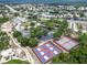 Overhead image of community amenities, including tennis and pickleball courts, ample parking, and recreational areas at 8228 Coral Creek Loop, Hudson, FL 34667