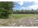 Overlooking lush green space, enjoy privacy and tranquility with nature's beauty right in your backyard at 8228 Coral Creek Loop, Hudson, FL 34667