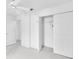 Bright bedroom includes a ceiling fan and closet for plenty of storage space at 8228 Coral Creek Loop, Hudson, FL 34667