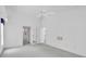 Spacious bedroom with ceiling fan, closet and ensuite bathroom at 8228 Coral Creek Loop, Hudson, FL 34667