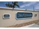 Elegant community sign displaying 'The Estates', highlighting a deed-restricted and well-maintained neighborhood entrance at 8228 Coral Creek Loop, Hudson, FL 34667