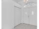 Bright entryway features white doors, tile flooring, and natural light from an arched window above the double doors at 8228 Coral Creek Loop, Hudson, FL 34667