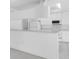 Bright, open kitchen featuring modern appliances and ample counter space, ideal for meal preparation at 8228 Coral Creek Loop, Hudson, FL 34667