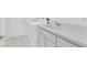 Well-equipped laundry area with modern appliances and white cabinets at 8228 Coral Creek Loop, Hudson, FL 34667