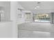Spacious living room with sliding glass doors opening to the pool area, enhancing indoor-outdoor living at 8228 Coral Creek Loop, Hudson, FL 34667