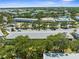 A pleasant aerial view shows lush surroundings, adjacent to community pool and recreation center at 8405 112Th St # 103, Seminole, FL 33772