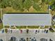 An aerial perspective displays the building's layout, parking, and landscaping at 8405 112Th St # 103, Seminole, FL 33772
