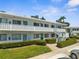 Charming exterior features manicured landscaping and walkways, adding to the curb appeal of this residence at 8405 112Th St # 103, Seminole, FL 33772