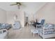 Inviting living room featuring neutral walls, carpet and tile flooring, and a ceiling fan at 8405 112Th St # 103, Seminole, FL 33772