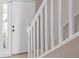A traditional entryway with white railing and door at 8526 Hawbuck St, Trinity, FL 34655