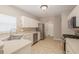 Kitchen with white cabinets, stainless steel appliances, and tiled backsplash at 8526 Hawbuck St, Trinity, FL 34655