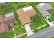 Aerial view of the property showcasing the home's layout, landscaping, and surrounding neighborhood at 8700 Wind Mill Dr, New Port Richey, FL 34655