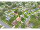 Bird's eye view showing the property's location in a quiet residential community with mature trees at 8700 Wind Mill Dr, New Port Richey, FL 34655