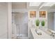 Full bathroom features a vanity and glass-enclosed shower at 8700 Wind Mill Dr, New Port Richey, FL 34655