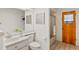 Bright bathroom featuring a single sink vanity and a separate shower stall at 8700 Wind Mill Dr, New Port Richey, FL 34655
