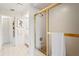 Bathroom showcasing a shower and bathtub combination with gold accents at 8700 Wind Mill Dr, New Port Richey, FL 34655