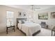 Comfortable bedroom with neutral tones, ample natural light, and a ceiling fan at 8700 Wind Mill Dr, New Port Richey, FL 34655