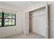 Interior shot of a bright closet featuring wire shelving and a window at 8700 Wind Mill Dr, New Port Richey, FL 34655