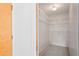 Walk-in closet with shelving for clothing storage at 8700 Wind Mill Dr, New Port Richey, FL 34655