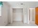 Interior shot of a bright closet featuring wire shelving and an open door to the hallway at 8700 Wind Mill Dr, New Port Richey, FL 34655