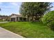 Lovely home with mature shade tree, screened entry, and well-kept lawn at 8700 Wind Mill Dr, New Port Richey, FL 34655