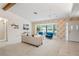 Spacious living room featuring a bay window, neutral carpet, and plenty of natural light at 8700 Wind Mill Dr, New Port Richey, FL 34655