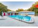 Community pool with mural and seating at 8700 Wind Mill Dr, New Port Richey, FL 34655
