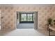 Enclosed sun room with large windows and a neutral color palette at 8700 Wind Mill Dr, New Port Richey, FL 34655