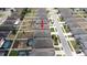 Aerial view of a home, emphasizing its neighborhood setting and proximity to surrounding homes at 905 Old Windsor Way, Spring Hill, FL 34609
