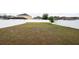 A large backyard with vinyl fencing offers privacy and ample space for outdoor activities at 905 Old Windsor Way, Spring Hill, FL 34609