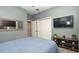 Relaxing bedroom featuring plush carpet, closet space, and a warm, inviting feel at 905 Old Windsor Way, Spring Hill, FL 34609