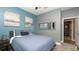 Comfortable bedroom with blue accent wall, plush carpet, and a serene atmosphere at 905 Old Windsor Way, Spring Hill, FL 34609