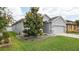 Charming home with lush landscaping and a well-manicured lawn at 905 Old Windsor Way, Spring Hill, FL 34609