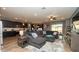 Spacious open floorplan shows the living room adjacent to the kitchen at 905 Old Windsor Way, Spring Hill, FL 34609