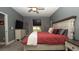 Bedroom with a comfortable bed, and a dresser with TV at 905 Old Windsor Way, Spring Hill, FL 34609