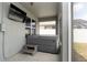 Relaxing screened patio area with a hot tub and mounted TV at 905 Old Windsor Way, Spring Hill, FL 34609
