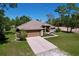 Aerial view of charming single Gathering home with a two car garage, and well-manicured lawn at 9152 Bunting Rd, Weeki Wachee, FL 34613